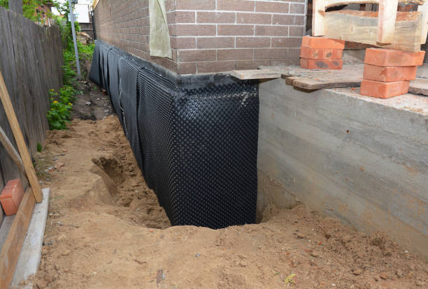 SJ Waterproofing Pros technician performing targeted Foundation Crack Repair assessment in Staunton, IN